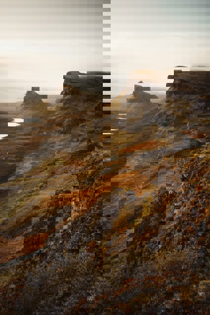 A view over the landscape of the Isle of Skye, showing craggy hills and valleys