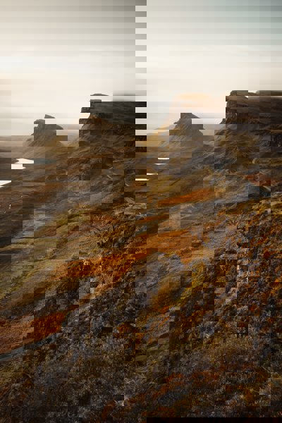 A view over the landscape of the Isle of Skye, showing craggy hills and valleys