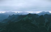 Photographic work of mountains with green shadow of person on horseback amongst mountain.