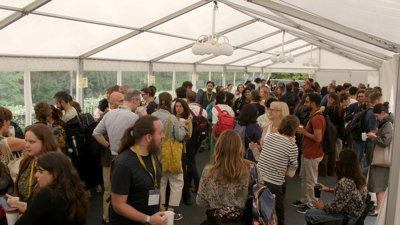 A large marquee filled with people inside.