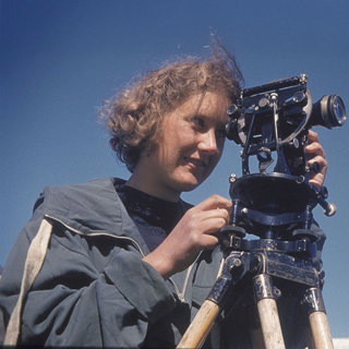 Cuchlaine King with a cameram, mapping at Austerdalsbre, Norway.