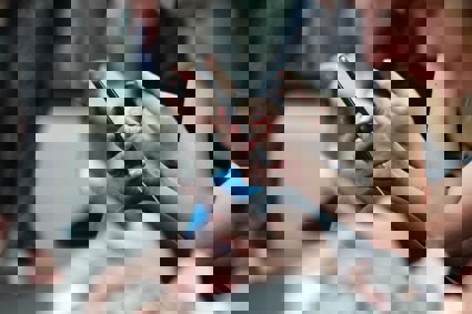 People looking at their mobile phones