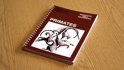 A copy of Expedition Field Techniques: Primates on a desk.