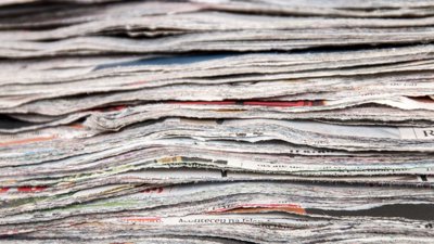 Pile of newspapers cut up.