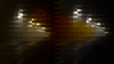 Turned on street lamps at night on empty street.