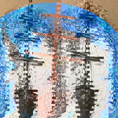 Endurance has been made using a paper plate and pained so that the boat is in the center surrounded by white a blue to signify Antarctica and ocean
