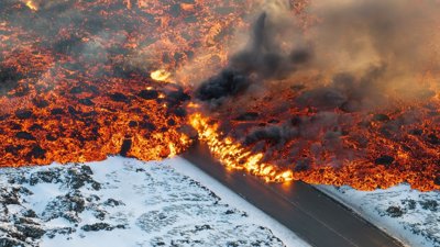 Volcanic eruption on a snow covered landscape. Photograph titled 'contrasts'.
