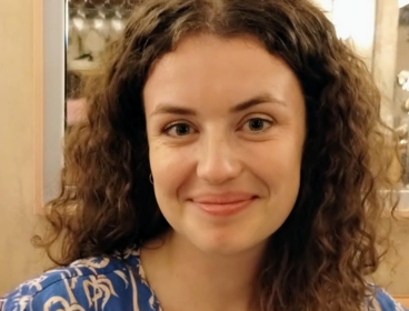 Headshot of Caitlin Robinson smiling at the camera.
