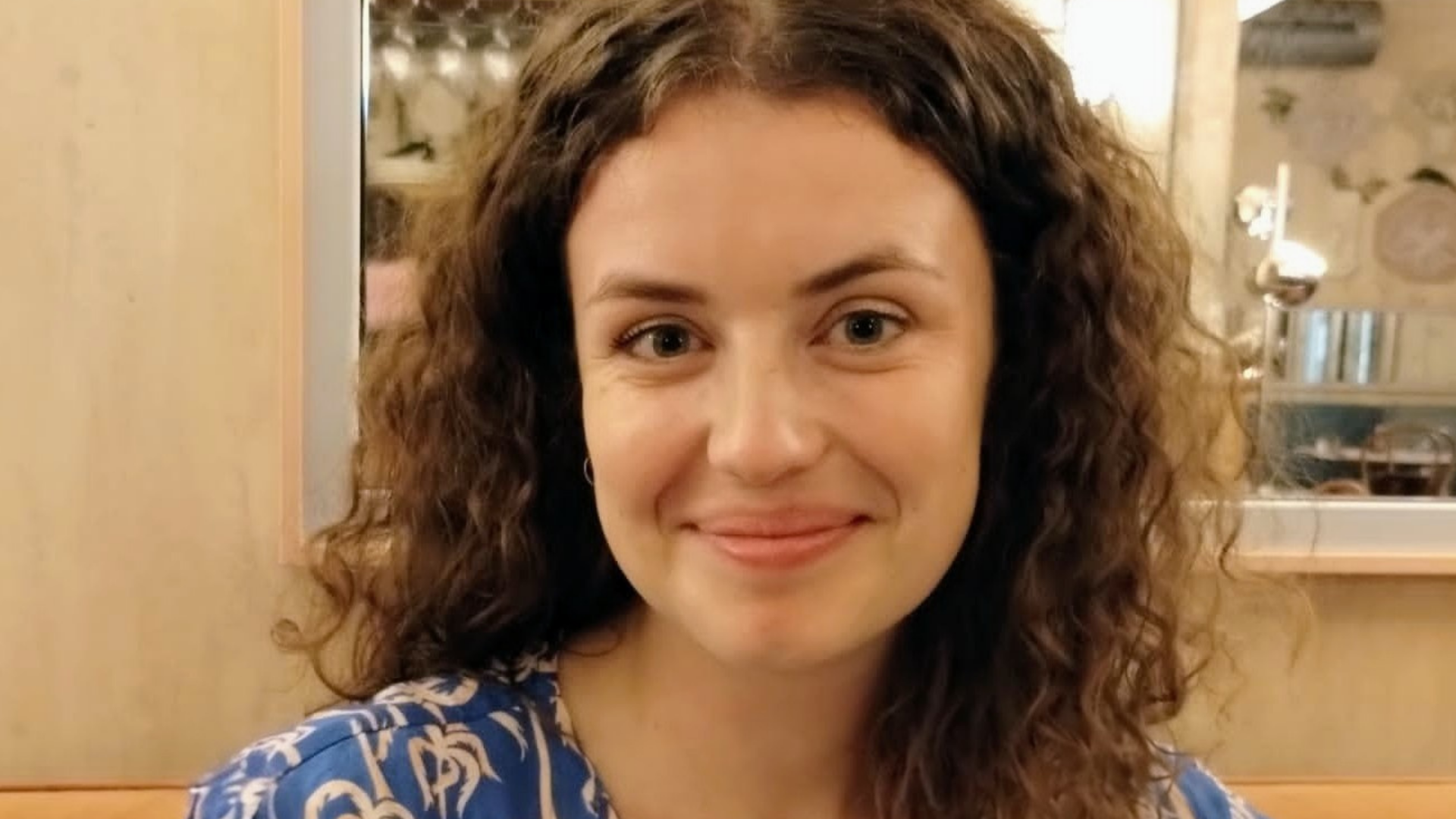 Headshot of Caitlin Robinson smiling at the camera.