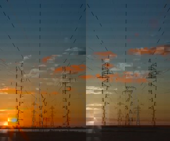 Electricity pylons stretching out into the distance