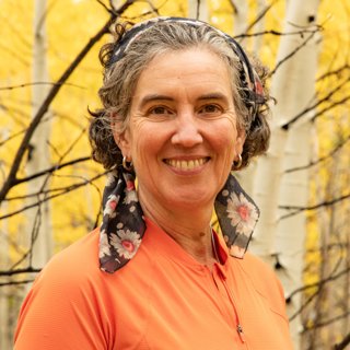 Harriet Fraser against forest background.