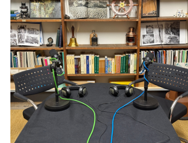 Stylysed headphone, a podcast studio, and podcast microphone stylised.