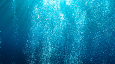 Underwater bubbles with light shining down