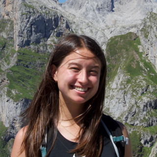 Heather Fortune in front of mountainous landscape.