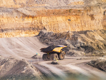 A dumper truck full of coal in a mine