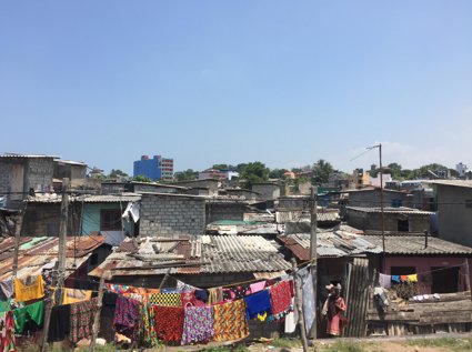 A settlement with colourful washing hanging up