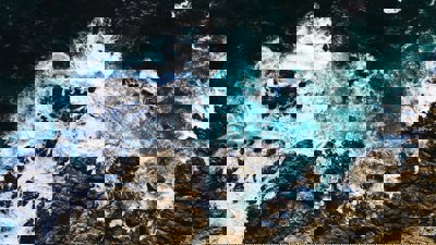 Waves crashing along the central coast of California in Big Sur. Seen from above.