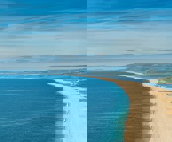 A long shingle barrier beach viewed from height