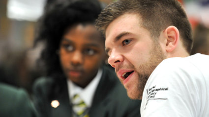 Professional Ambassador with a student