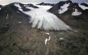 Medial moraines emerging near the snout of a glacier
