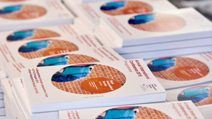 A stack of printed 2019 Annual International Conference programmes.
