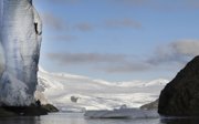 A man climbing an icy mountain.