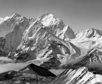 Panoramic view of Mount Everest with snow capped mountains in black and white.