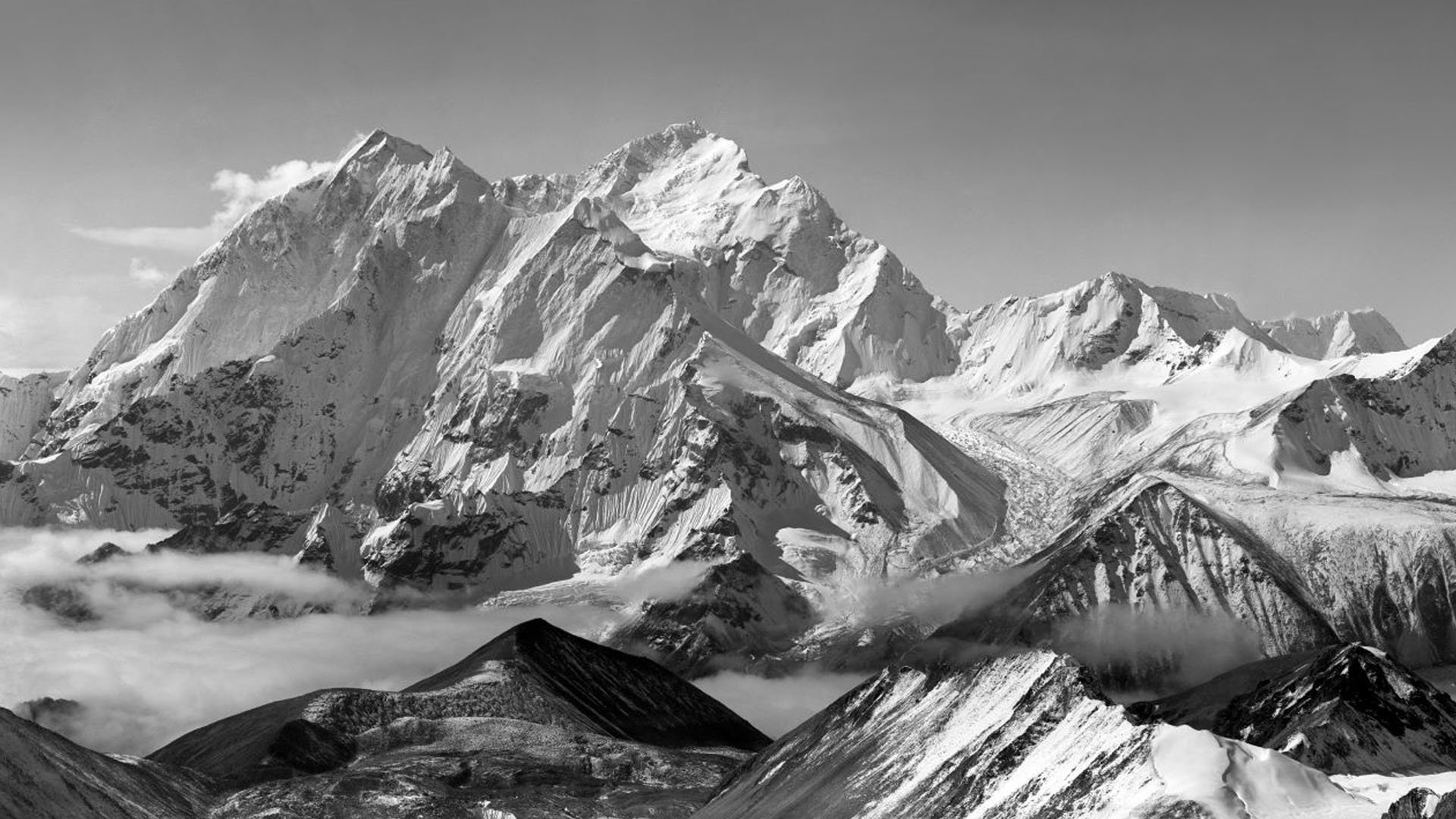 Panoramic view of Mount Everest with snow capped mountains in black and white.