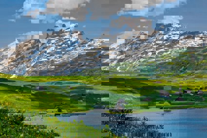 Mountains and green hills with houses