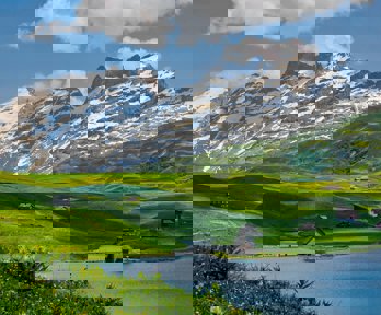 Mountains and green hills with houses