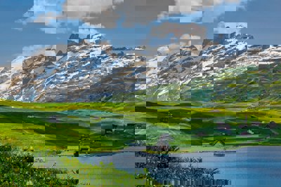 Mountains and green hills with houses