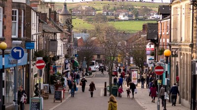 People walking on busy UK highstreet.