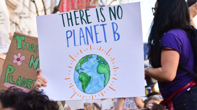 Crowd holding signs 'there is no planet b'