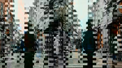 Person Walking Through A High Street