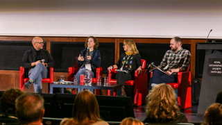 Four speakers on stage at Explore in Ondaatje Theatre