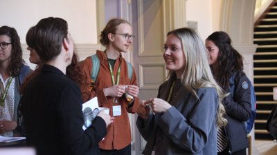 People networking at the royal geographical society.