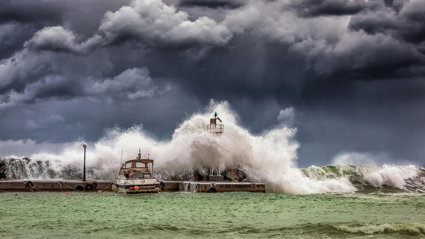 A green stormy sea with grey storm clouds above