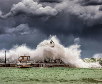 A green stormy sea with grey storm clouds above