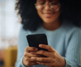Person types on phone