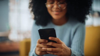 Person types on phone