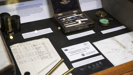 Display of historic materials, including archival papers and scientific instruments.