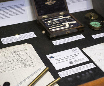 Display of historic materials, including archival papers and scientific instruments.