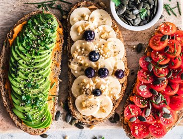 Slices of bread with assorted fruits and vegetables.