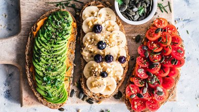 Slices of bread with assorted fruits and vegetables.