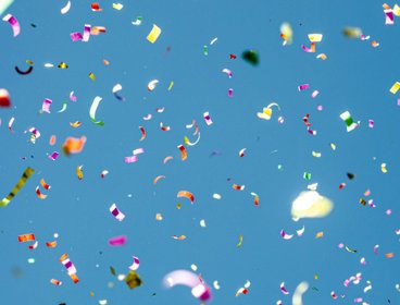Blue sky with multicoloured confetti.