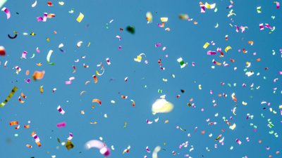 Blue sky with multicoloured confetti.