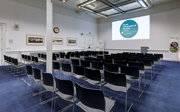 A side shot of the education centre set-up in a lecture theatre style. 