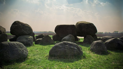 Stone formation on a green bank.