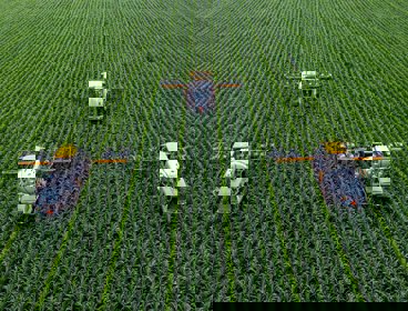A green field with framing machinery