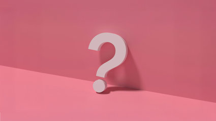 White question mark on a pink background.